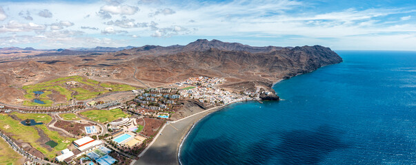 Volcanic beach of the tourist seaside town of Las Playitas, aerial view, Fuerteventura, Canary Islands, Spain