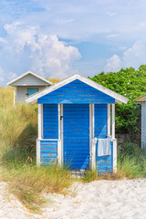 Fototapeta na wymiar Skanor Beach Hut in Blue and White