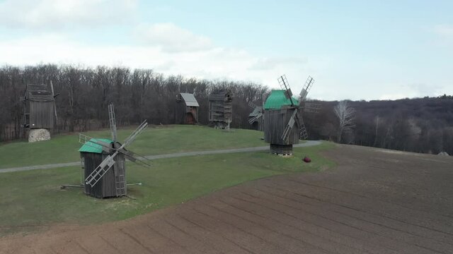 Wooden wildmill in outdoor museum. Drone landscape of national ukrainian park