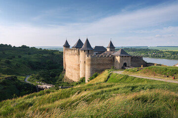 Fototapeta na wymiar Ancient Khotyn Fortress on the bank of Dniester River in Ukraine. Entrance view of medieval castle at summertime. Ukraine landmarks and monuments