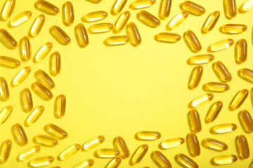 Omega 3 capsules on a colored background close-up with place for text.