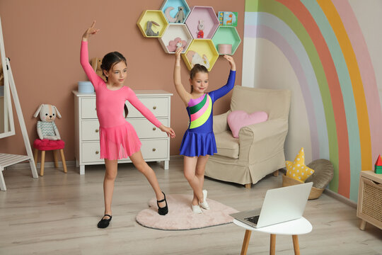 Cute Little Girls Taking Online Dance Class At Home