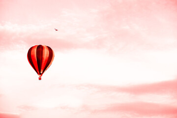 Hot air balloon in summer sunset red sky with copy space. concept of delivery of goods by air