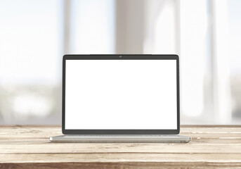 Laptop with blank screen on table - mockup template
