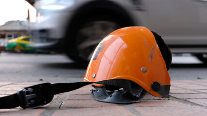 Broken helmet after Motorcycle bike accident on a traffic. Concept of safety transport ration