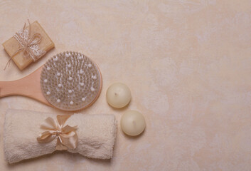 SPA concept. Body brush, scented soap and towel. Blank space for inscription