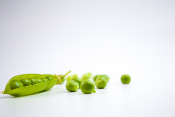Fresh green pea pod on white background
