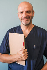 Studio portrait of doctor holding note board, healthcare worker