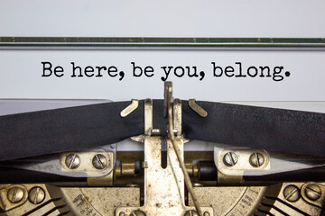 You belong here symbol. Words 'Be here, be You, belong' typed on retro typewriter. Diversity,...