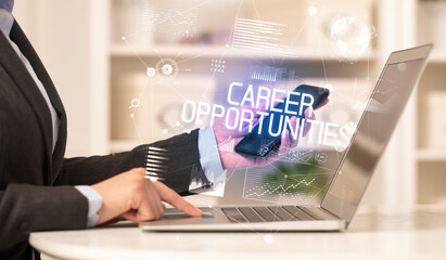 Side view of a business person working on laptop