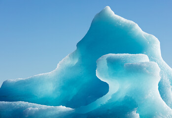 Shiny blue ice texture of glacial iceberg