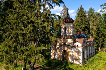 Fototapeta premium abandoned Orthodox Church in the forest, Galgauska, Latvia, disappearing history, aerial view