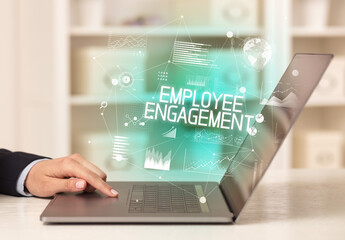 Side view of a business person working on laptop