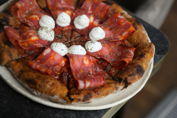 Traditional Italian pizza with sausage and ricotta