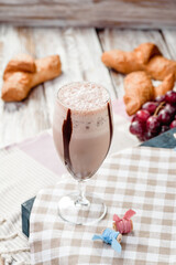 Chocolate milkshake in nice French composition. Space for text. High quality photo