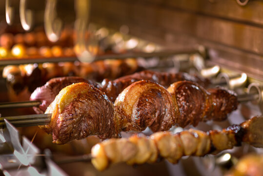 Picanha barbecue roasted over hot coals. Brazilian food churrasco.