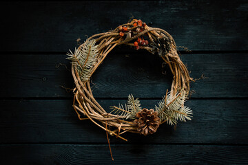 new year christmas wreath on an old wooden table, decor for the holiday