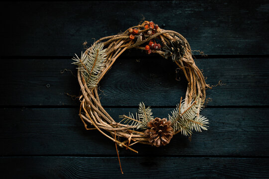 new year christmas wreath on an old wooden table, decor for the holiday - Powered by Adobe