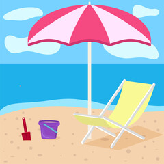  Deck chair and bucket with shovel on the beach under an umbrella