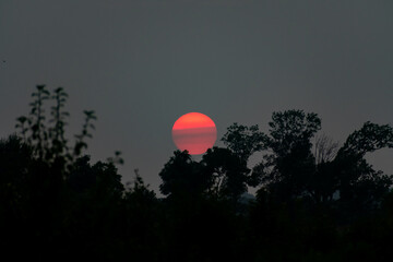 Red Sunset over Virginia as a result of atmospheric smoke related to climate change wildfires in the western United States.