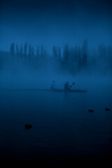 rowing on the river in the fog - 446661269