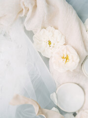 Obraz na płótnie Canvas top view of flowers and bridal veil arrangement