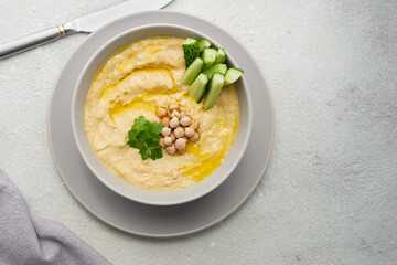 healthy chickpea hummus with olive oil in a bowl