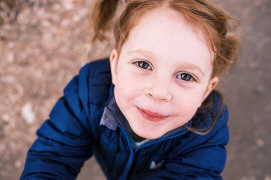 Portrait of a young girl with red hair