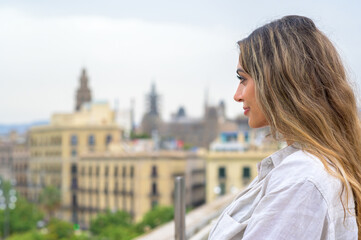 Fototapeta premium Caucasian woman in Barcelona, Spain. Posing near port