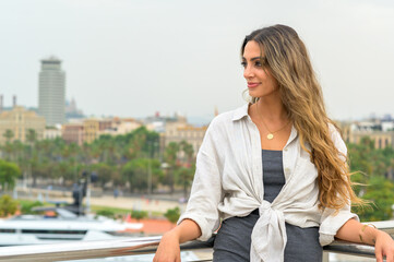 Caucasian woman in Barcelona, Spain. Posing near port