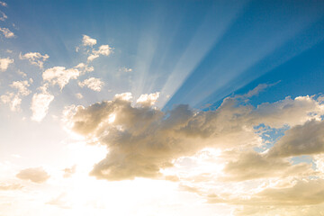 clouds and golden sky,Sun beams or rays breaking through the dark clouds at sunset. Hope, prayer, God's mercy and grace.