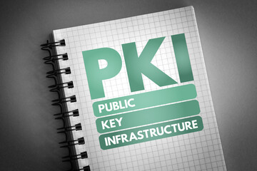 PKI - Public Key Infrastructure acronym on notepad, technology concept background