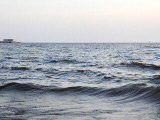 small surf waves on a sandy beach