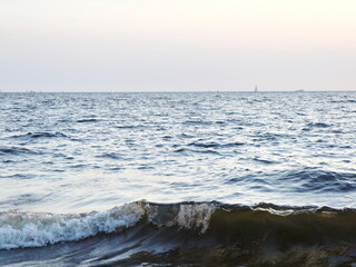 small surf waves on a sandy beach