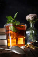 Ice cold infusion of mint with ounces of dark chocolate. Summer plans for a quiet afternoon. Mint, chocolate and books at sunset