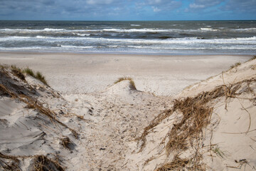 Path to the beach through dunes