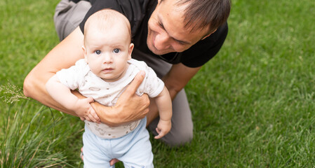 Fototapeta premium Little baby on fresh green grass outdoors