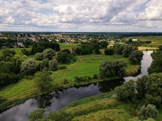 Fototapeta na wymiar Fields, meadows in rural green areas by the river - top view - drone photo