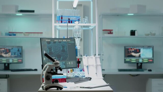 Nobody in scientific laboratory with research instruments for healthcare treatment innovation. Empty room of biochemistry labware with computer, test tube, microscope used in development