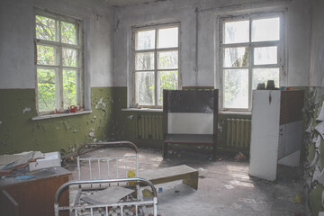 Empty Kindergarten Building. Baby cots arranged in disarray. Abandoned building in Pripyat