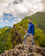 Man hiking modeling in the Mountains of Hawaii
