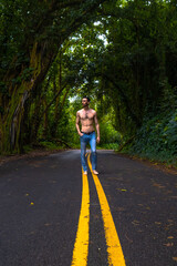 Man standing in a road in Hawaii