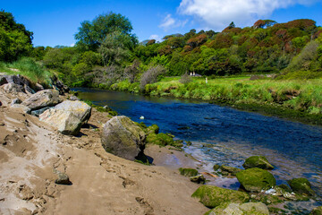 River with big boulders on its bank