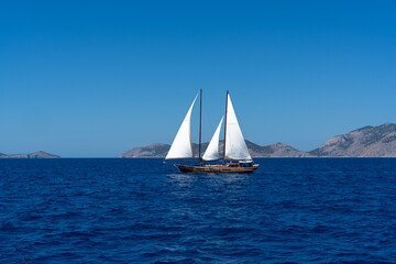 Beautiful sailboat in the Mediterranean Sea  along the greek coast.
