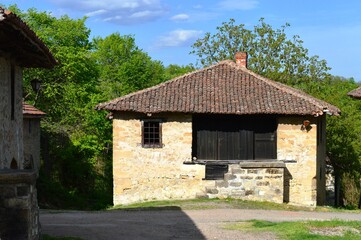 Fototapeta na wymiar an abandoned old stone house in the village