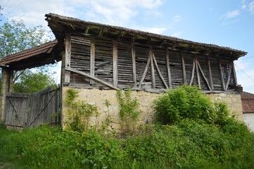 Fototapeta na wymiar old village wooden barn and gate