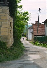 Fototapeta na wymiar one man on the street of an abandoned village