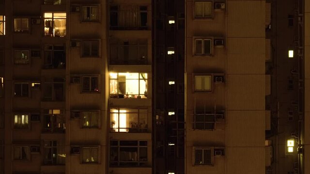 Windows group on and off timelapse of Hong Kong crowded residential apartment building