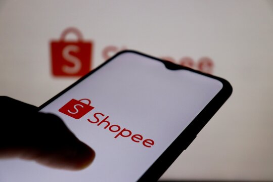 Bahia, Brazil - July 21, 2021: Shopee logo on smartphone screen. Shopee is a Singaporean multinational technology company which focuses mainly on e-commerce. 