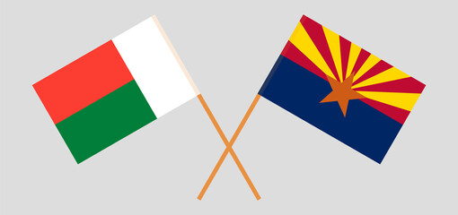 Crossed flags of Madagascar and the State of Arizona. Official colors. Correct proportion